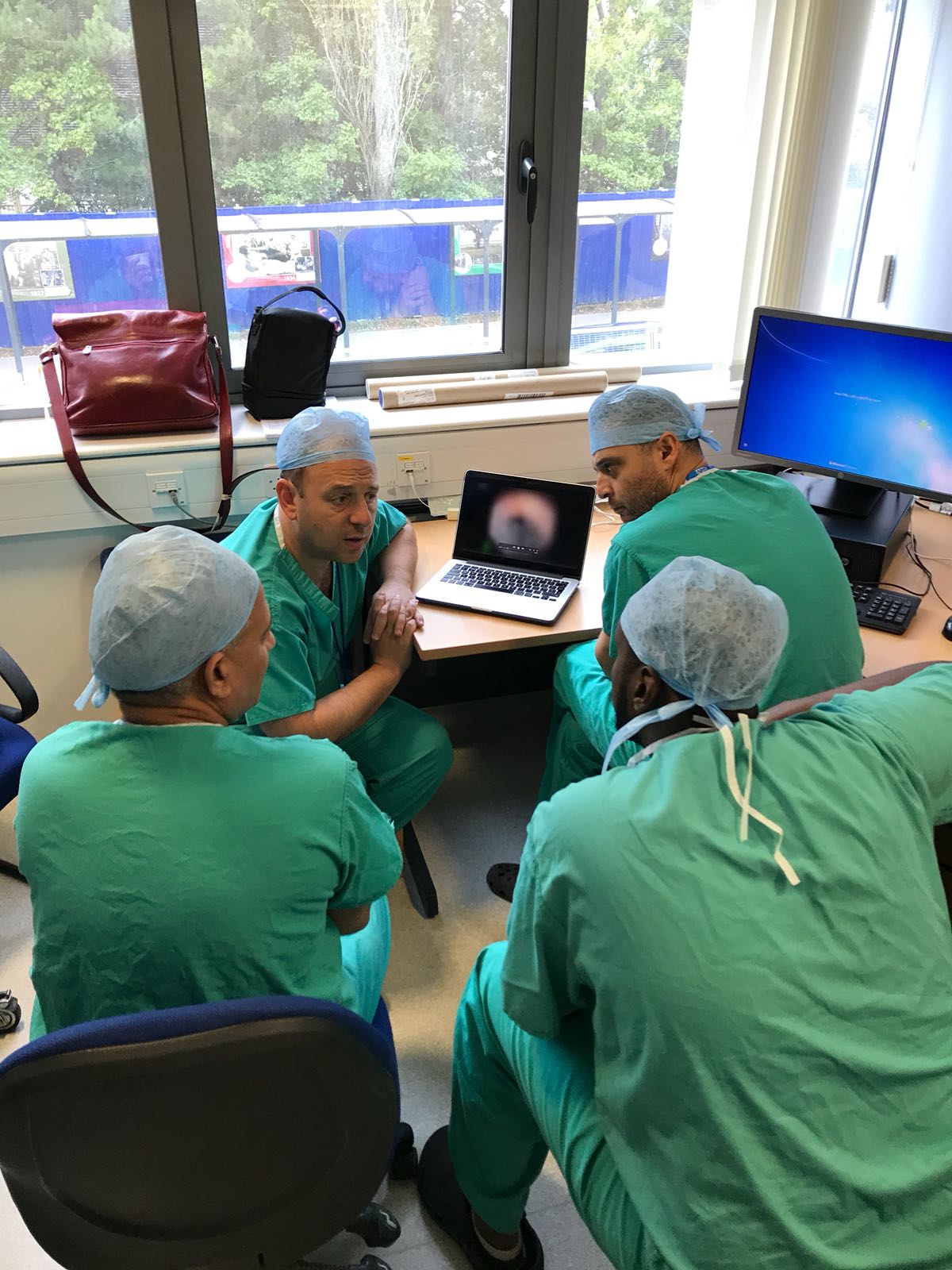Mr Wiseman teaching visiting surgeons in theatre
